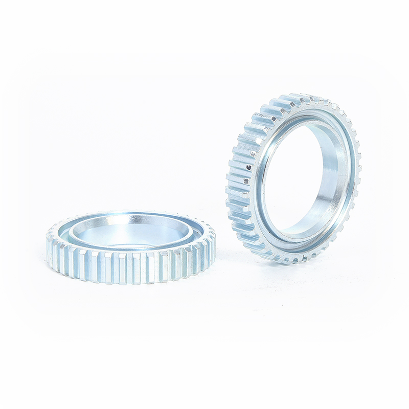 Can the ABS gear ring be cleaned or lubricated to enhance its performance?